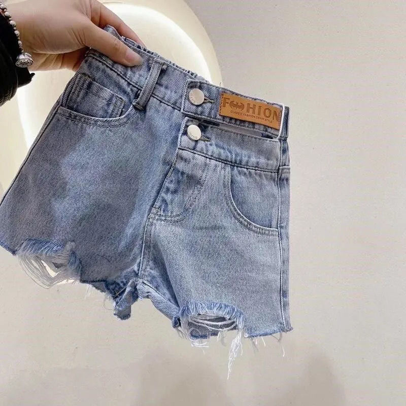 Korean style children's clothing girls' summer new Hong Kong style casual fashion Western style all-match leather logo hollow out Denim shorts fashion